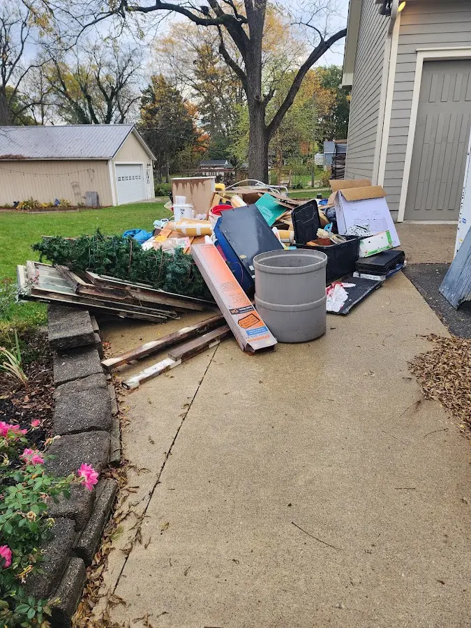 Dumpster being loaded with debris for 12 Yard Dumpster Rental in Mount Penn